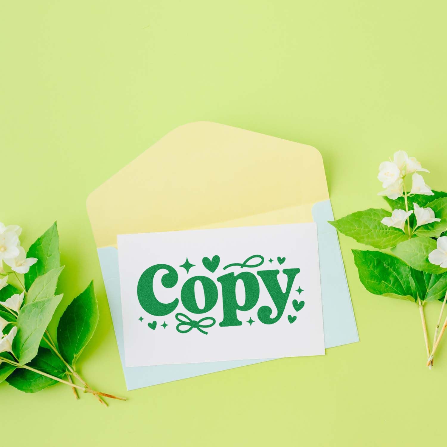 Copy rubber stamp design on a greeting card mockup with floral accents, ideal for stationery and craft branding.