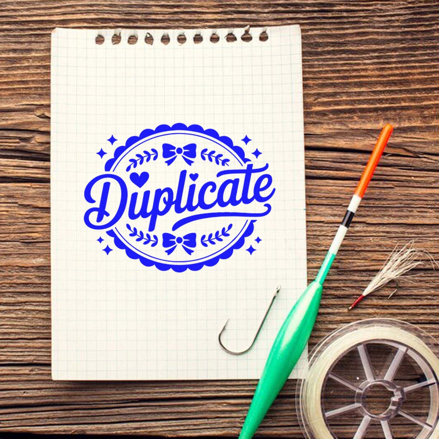 Decorative duplicate rubber stamp design for office documents, featuring a blue imprint on notebook paper.