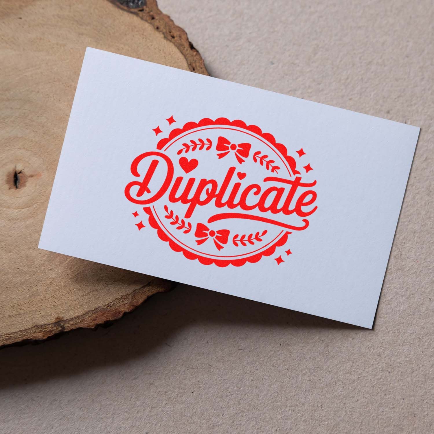 Red Duplicate rubber stamp impression on white card, ideal for office document labeling and custom stamp branding.