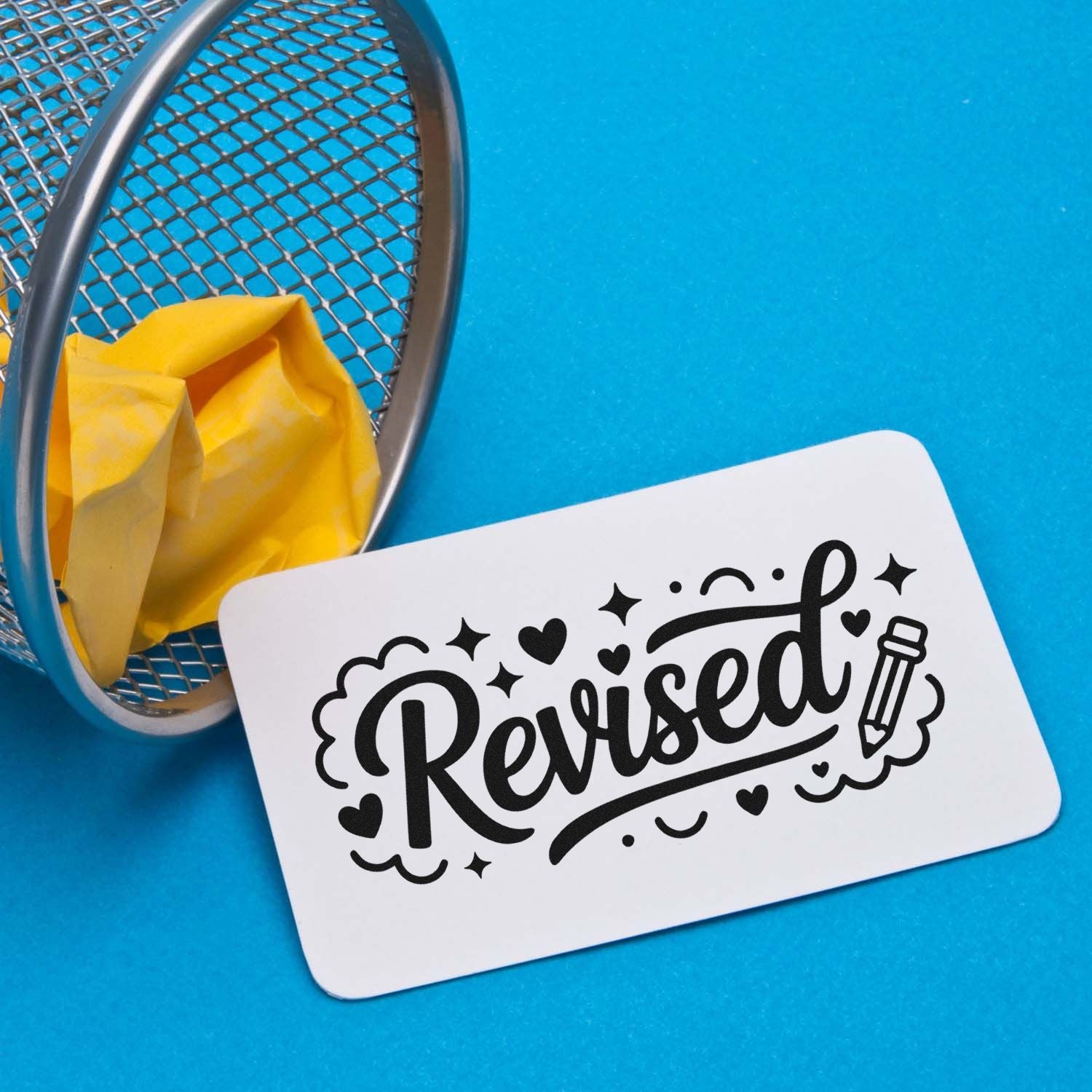 Revised rubber stamp with decorative lettering, pencil icon, and hearts for editing, proofing, or classroom use.