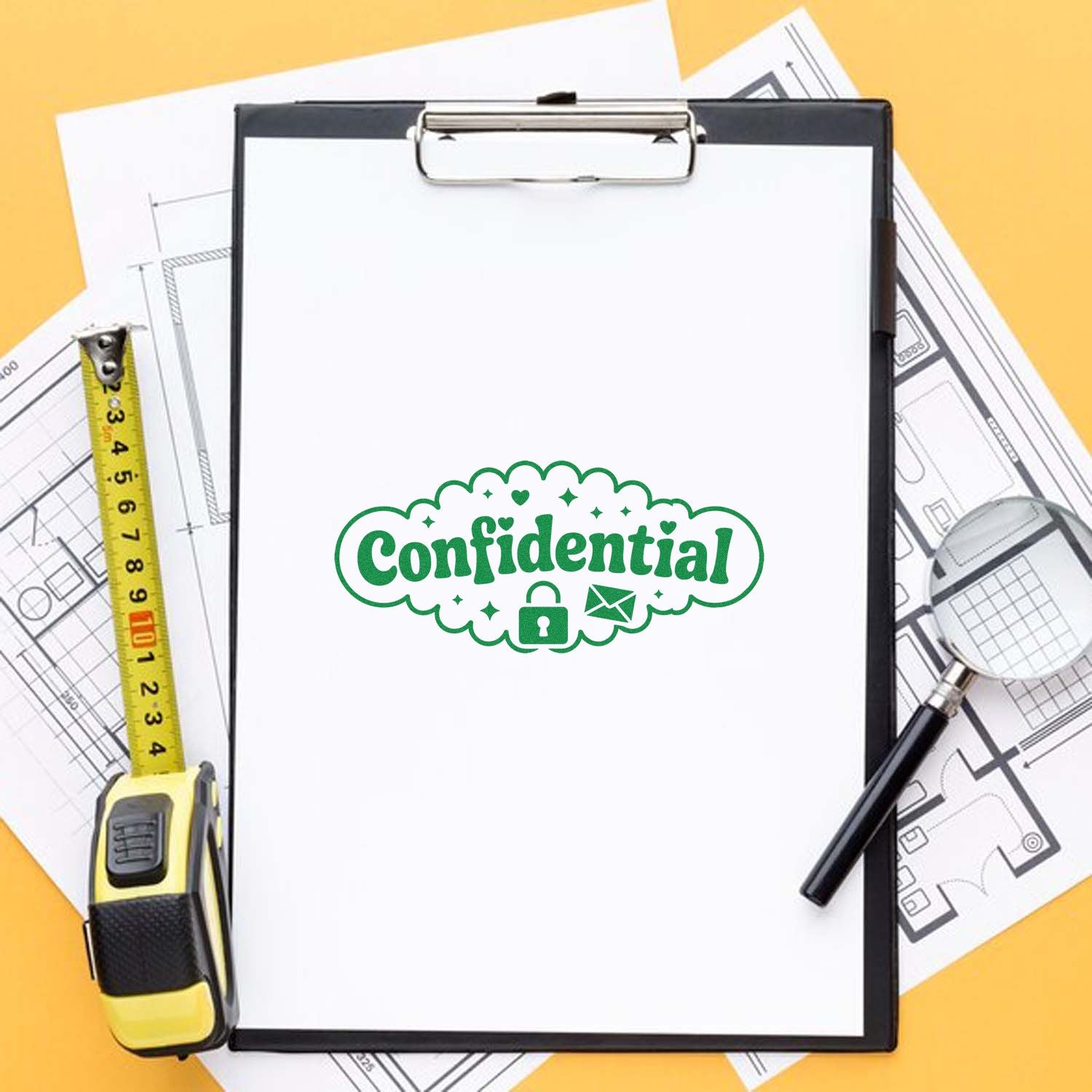 Confidential rubber stamp on clipboard with blueprints, measuring tape, and magnifying glass for secure office paperwork.