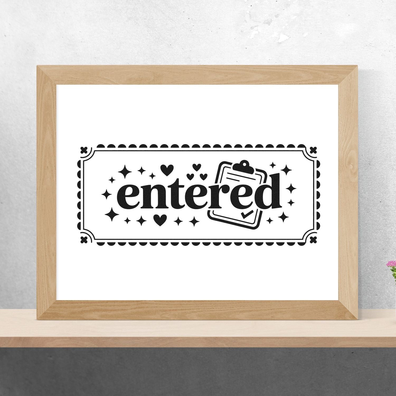 Entered rubber stamp design with decorative border, hearts, stars, and clipboard icon mockup