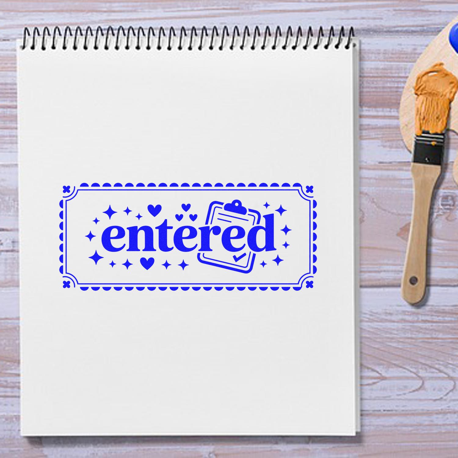 Blue entered rubber stamp design on notebook, ideal for office paperwork, planners, and document tracking.