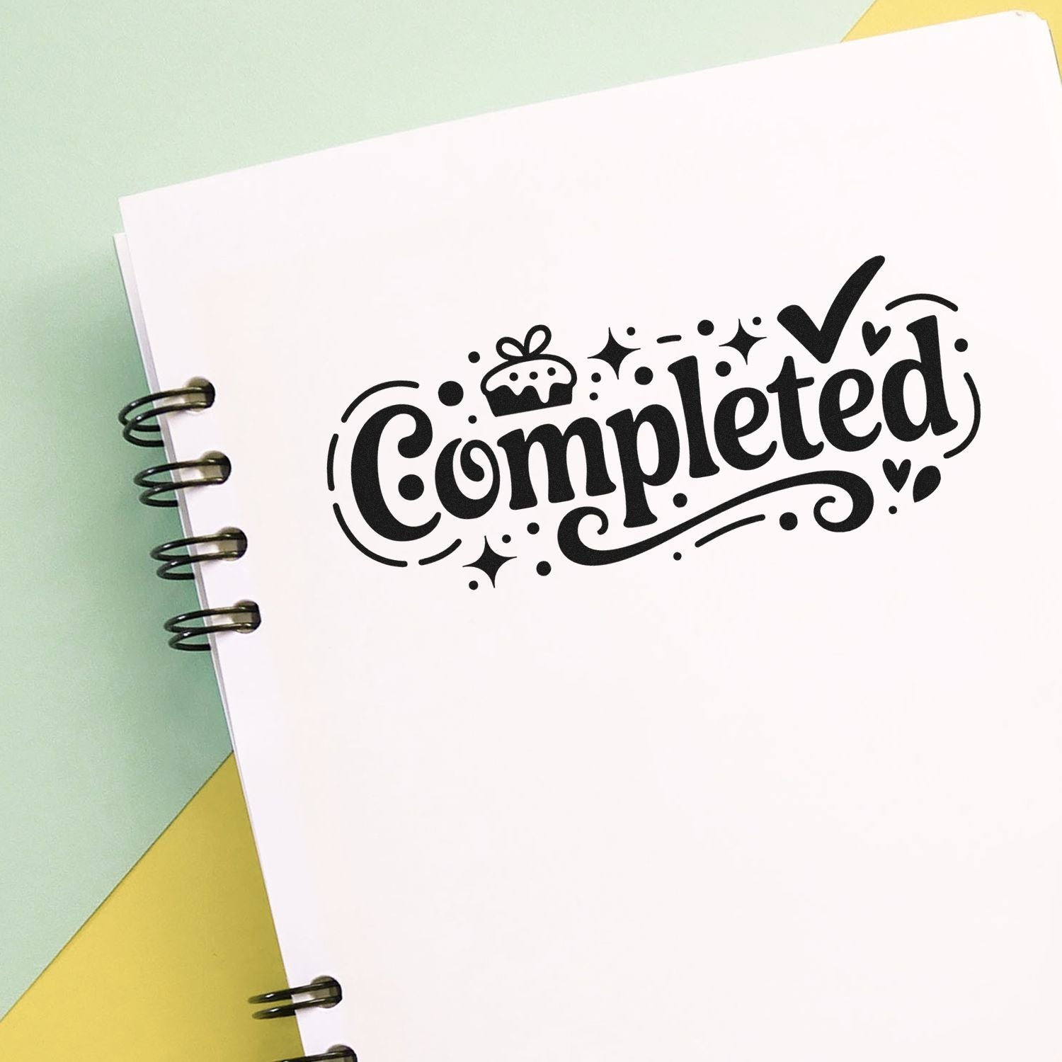 Decorative Completed rubber stamp design on notebook page for planners, journals, and craft projects.