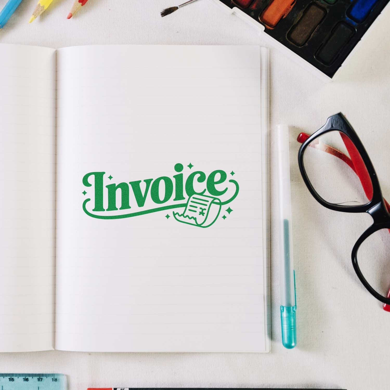 Green invoice rubber stamp design on notebook with stationery for office bookkeeping and accounting.