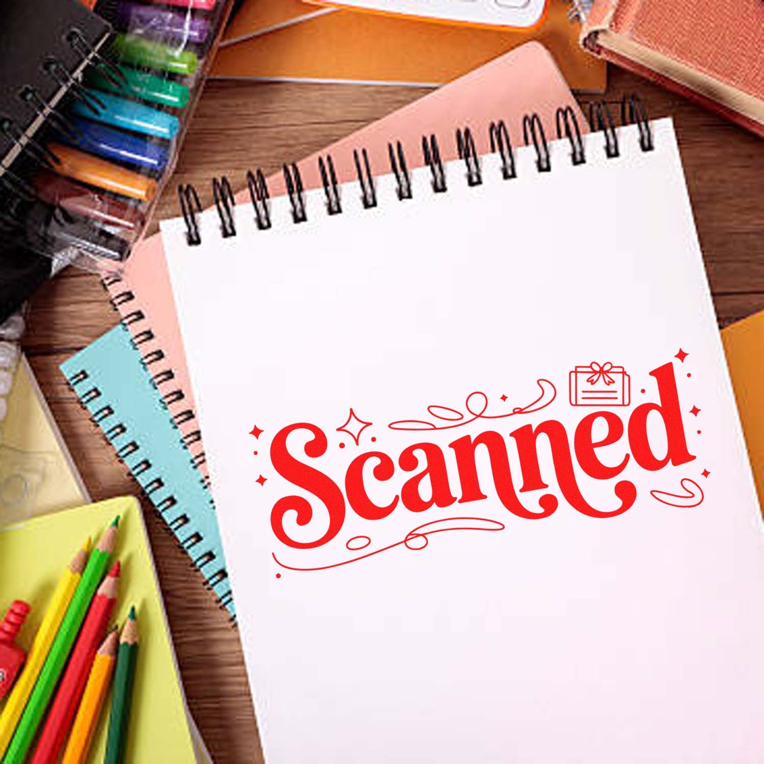 Red Scanned rubber stamp on notebook page with stationery, ideal for office document approval and organization.