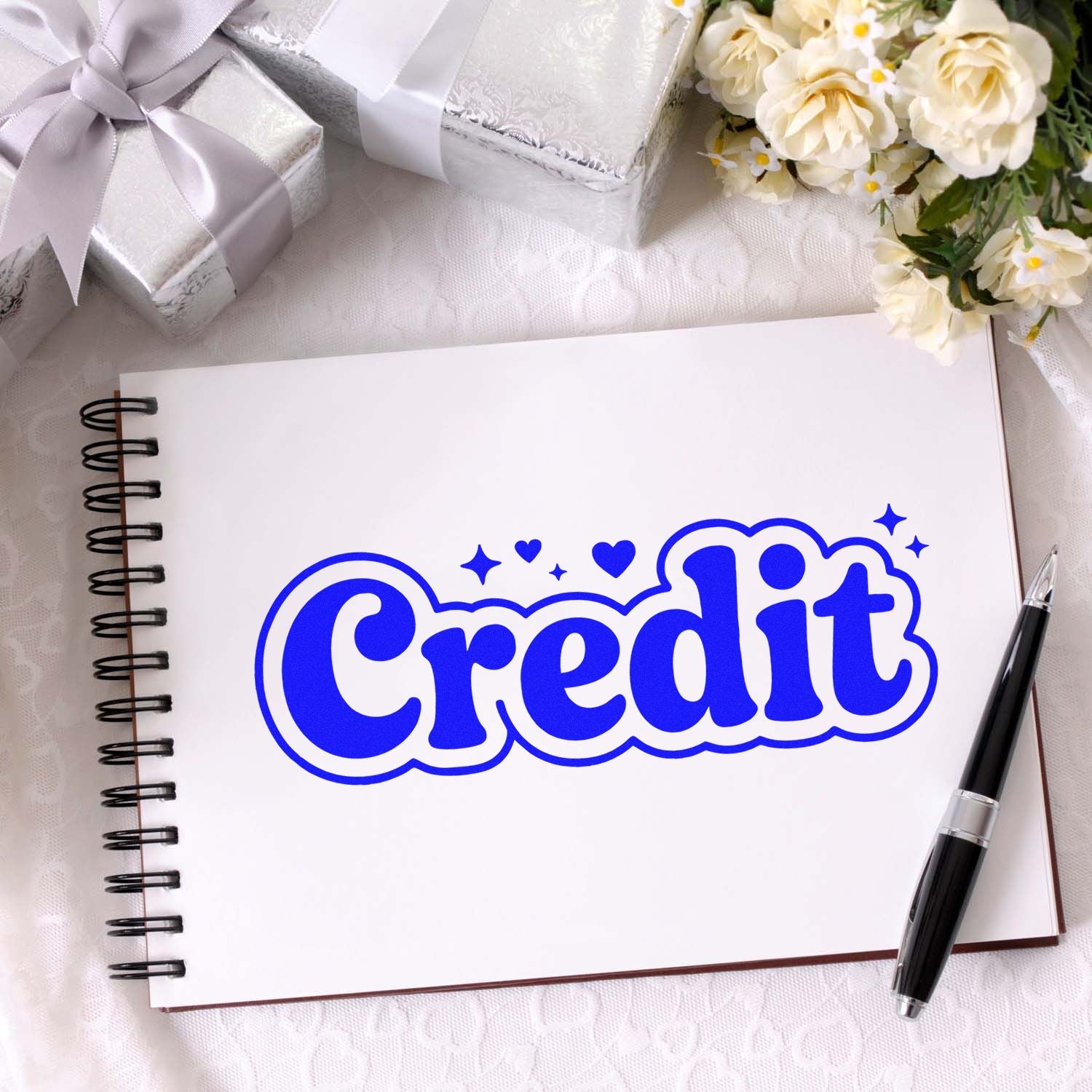 Blue Credit rubber stamp design on notebook, ideal for accounting, bookkeeping, and finance labeling.