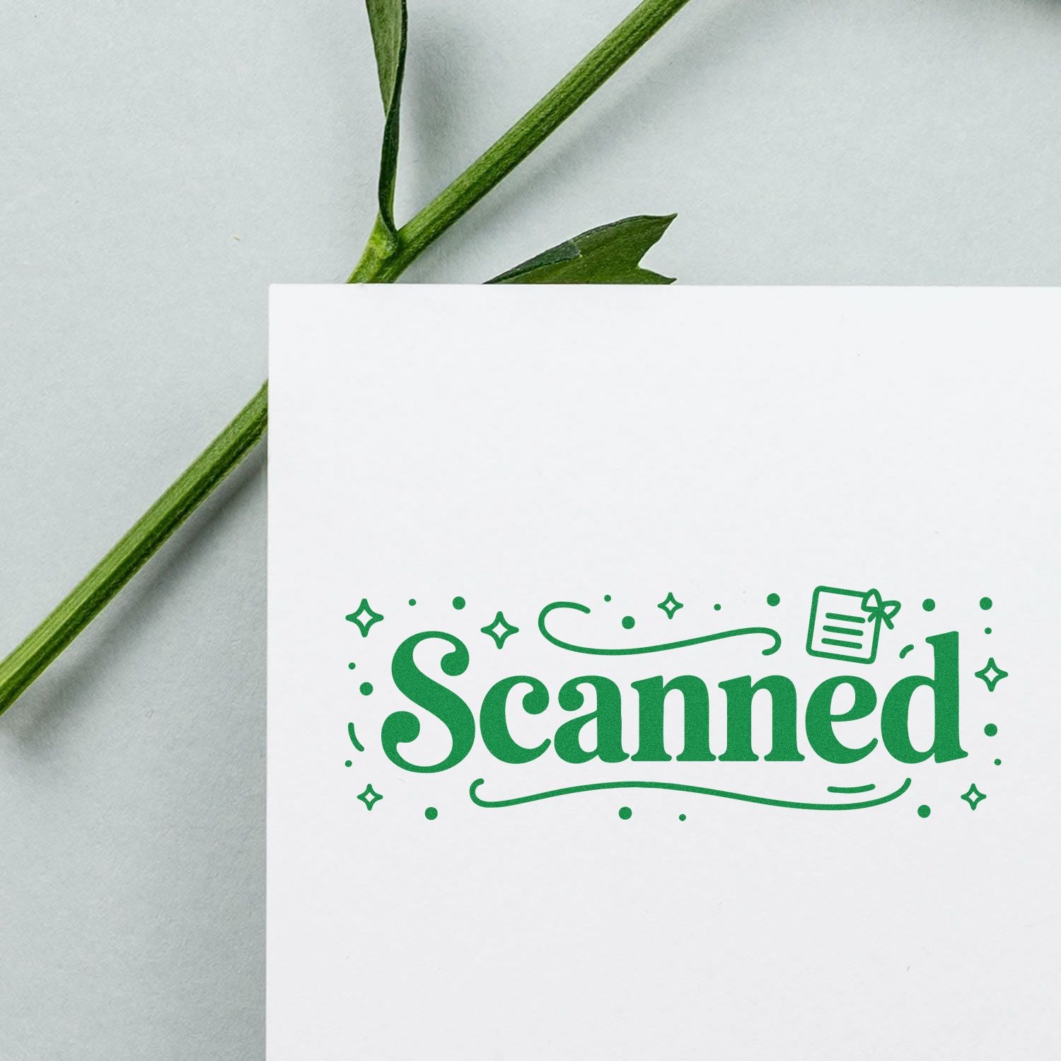 Green Scanned rubber stamp design on white paper, ideal for office document marking, filing, and craft labeling.
