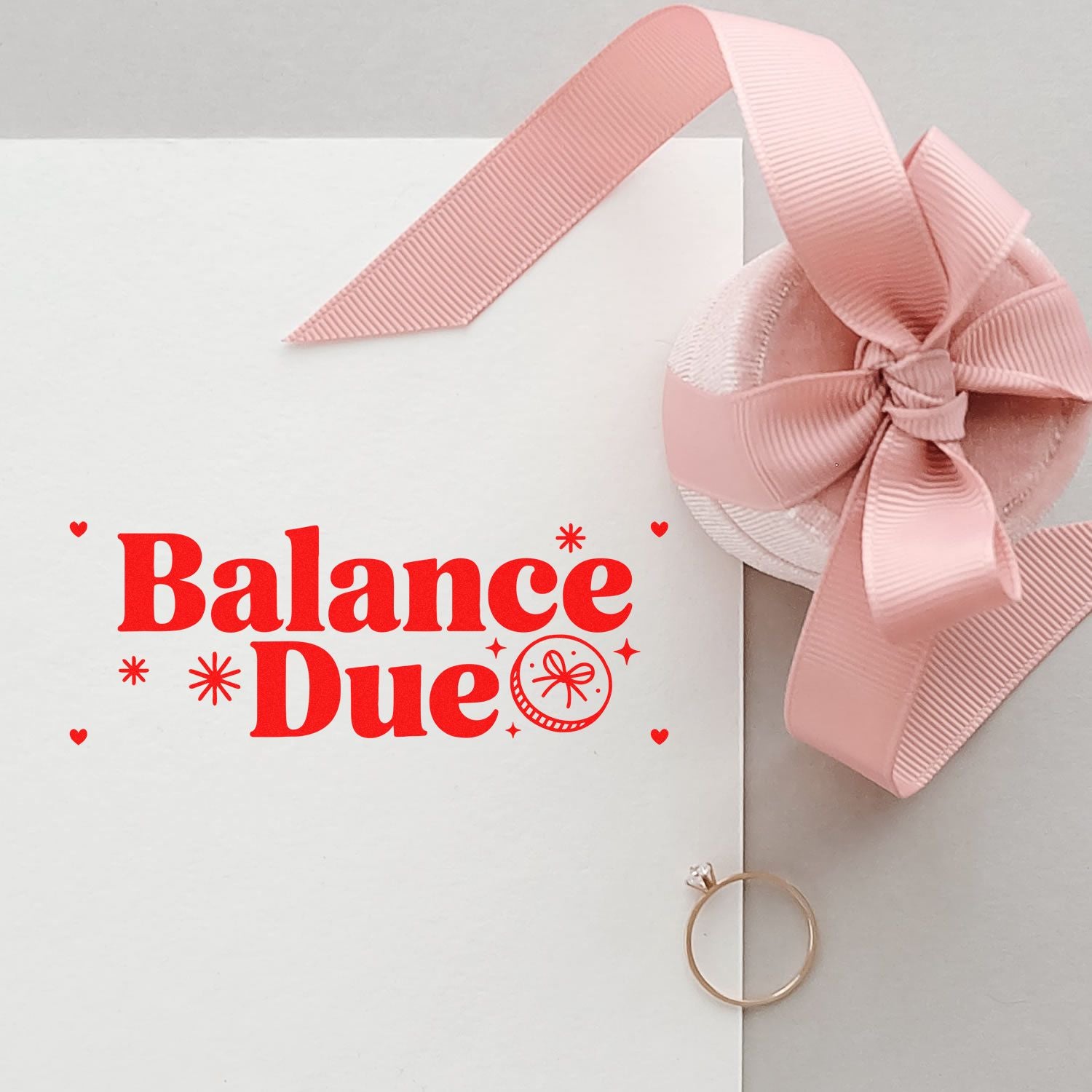 Balance Due rubber stamp on white stationery with pink ribbon, ideal for invoice reminders, billing, and packaging.