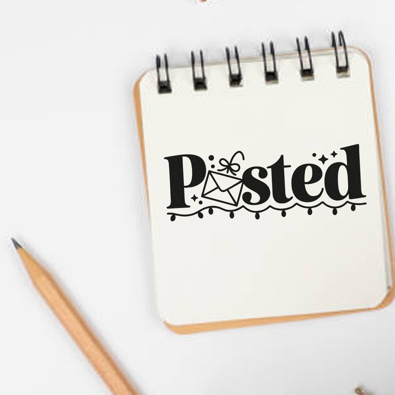 Posted rubber stamp design with envelope icon on notebook, ideal for mail, packaging, and handmade business branding.