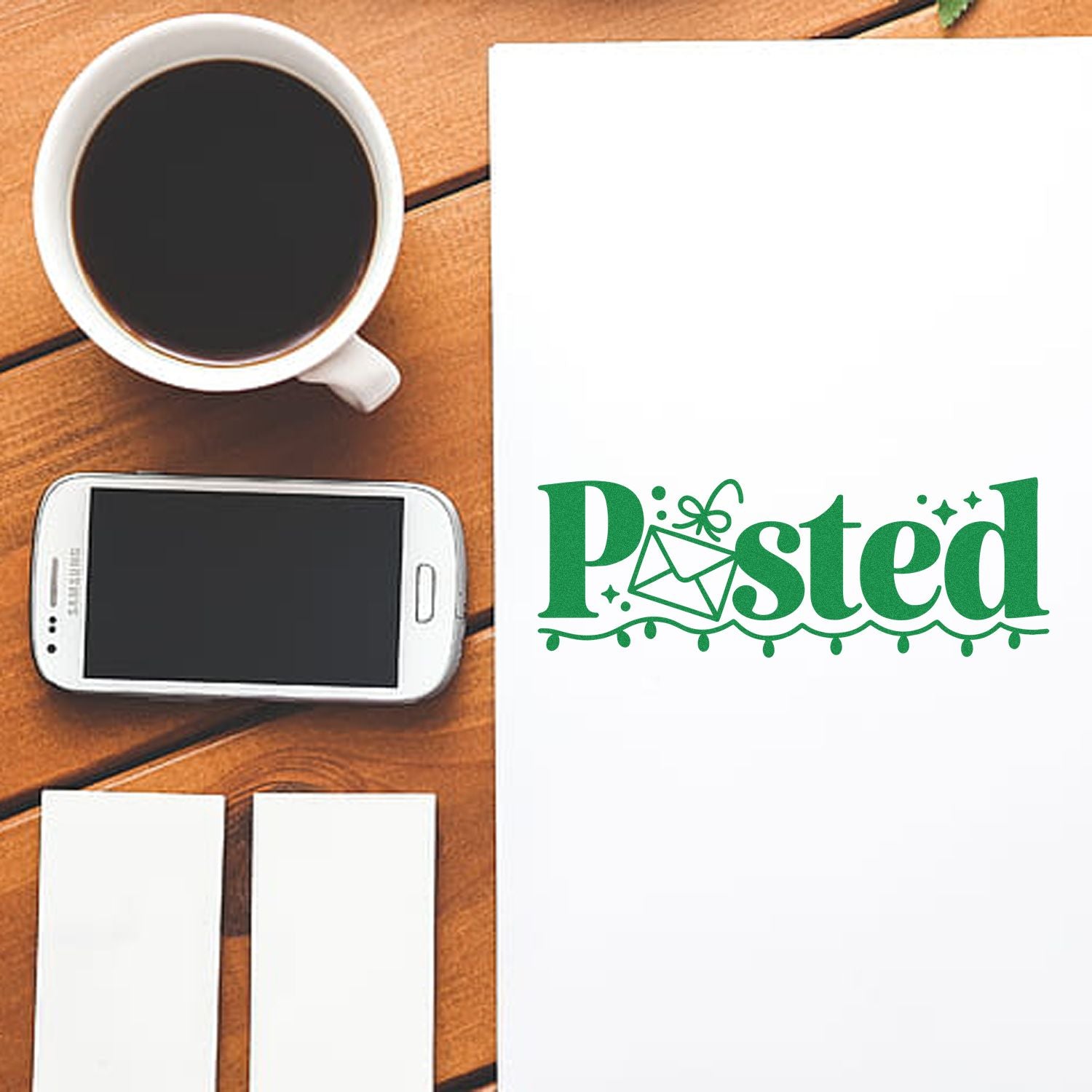 Custom Posted rubber stamp design on paper beside coffee, phone, and blank cards for mail and office use.