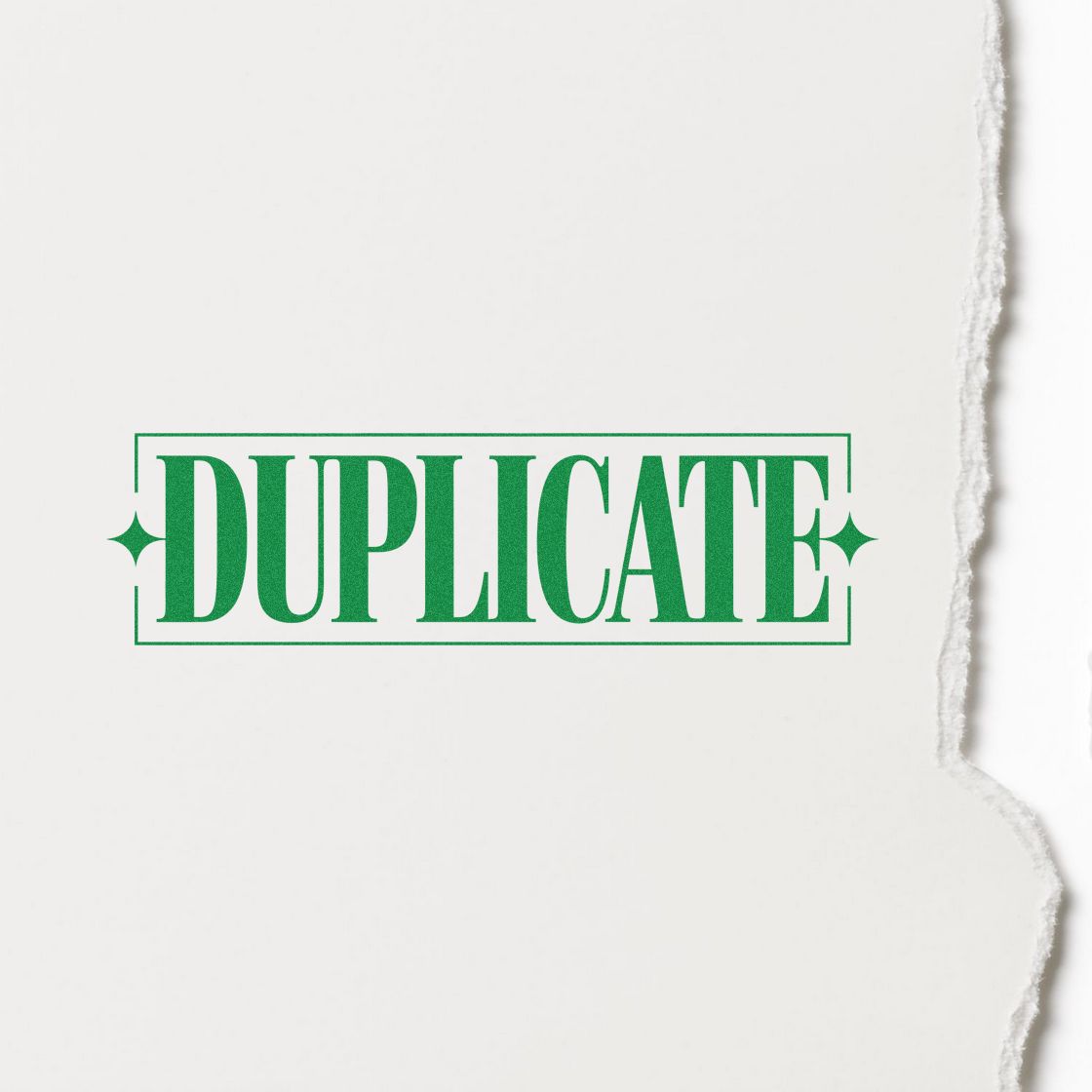 Green DUPLICATE rubber stamp imprint on torn paper for office document copying and file marking.