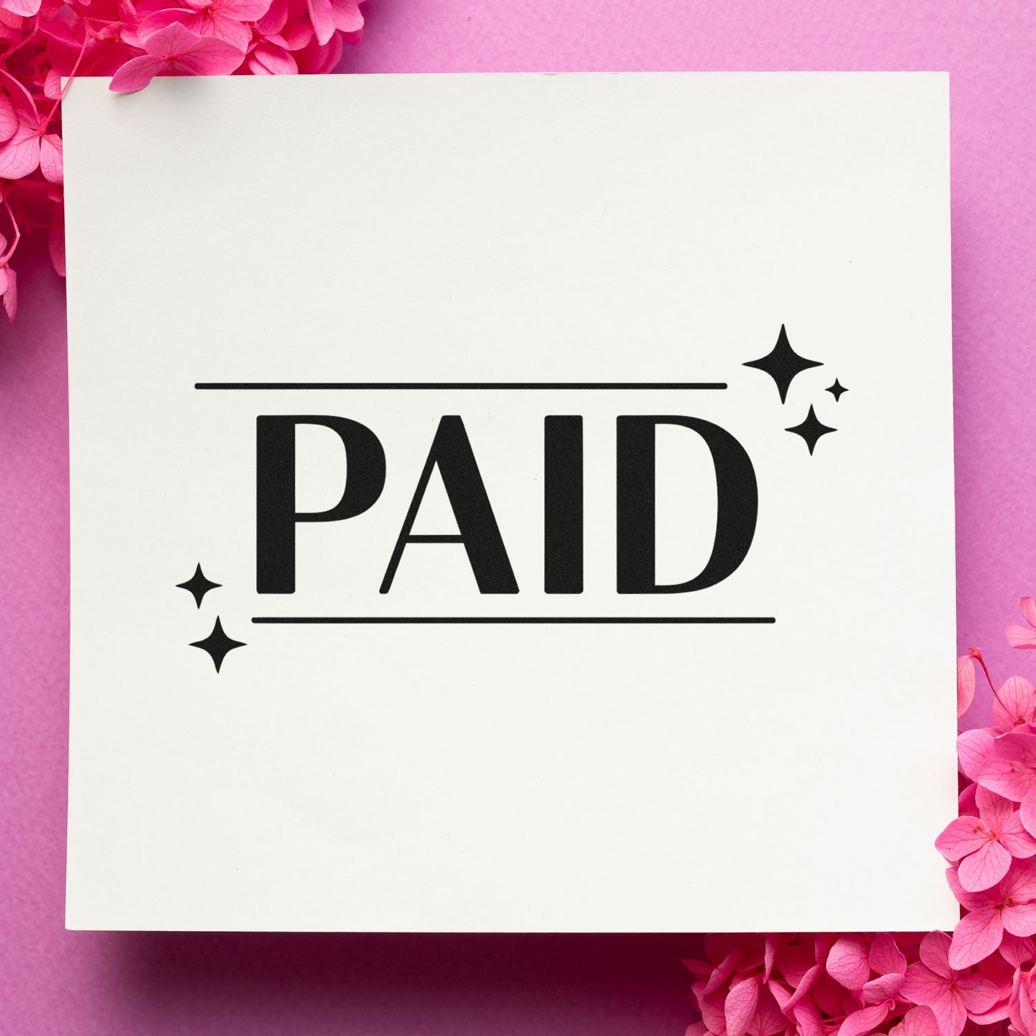 PAID rubber stamp design for invoices, receipts, and business paperwork with decorative sparkle accents.