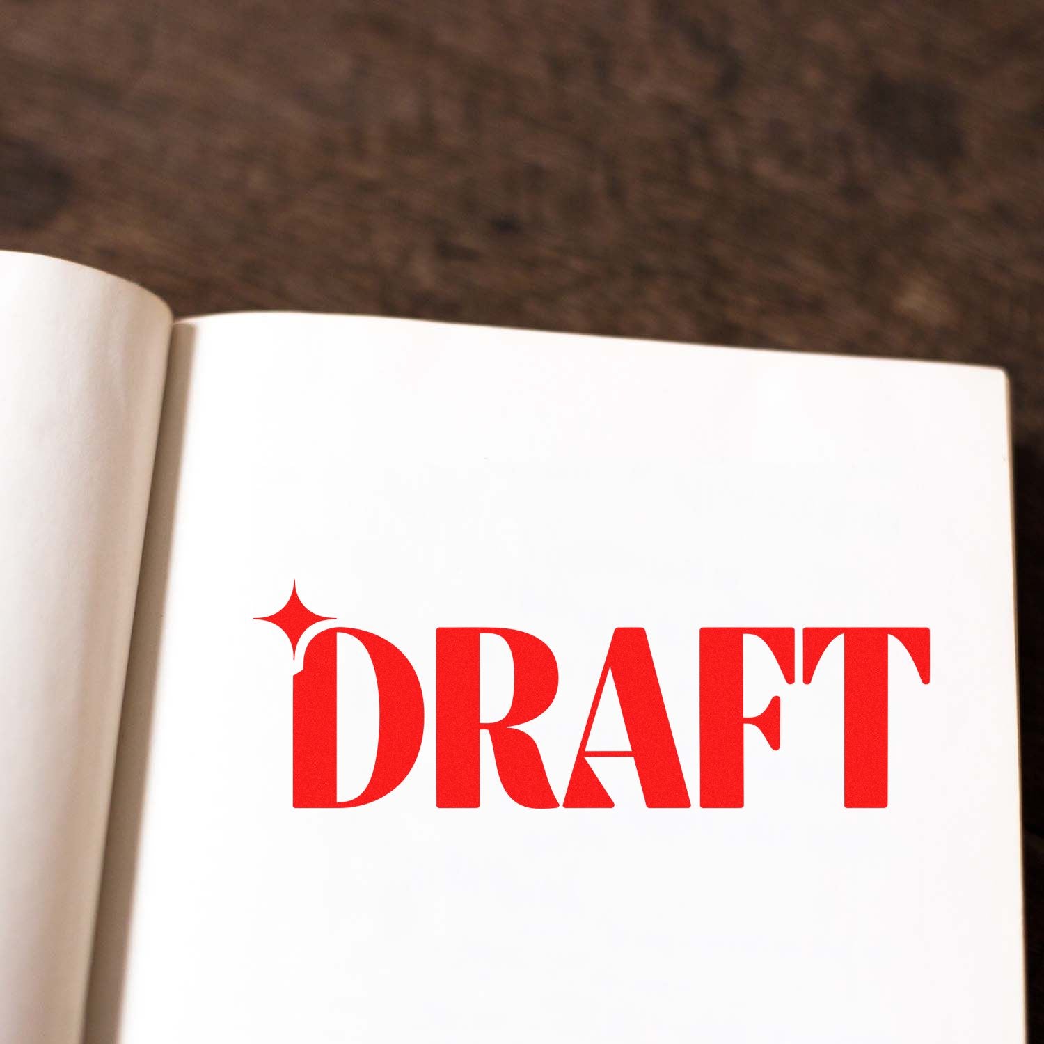 Red DRAFT rubber stamp marking an open notebook page for document review
