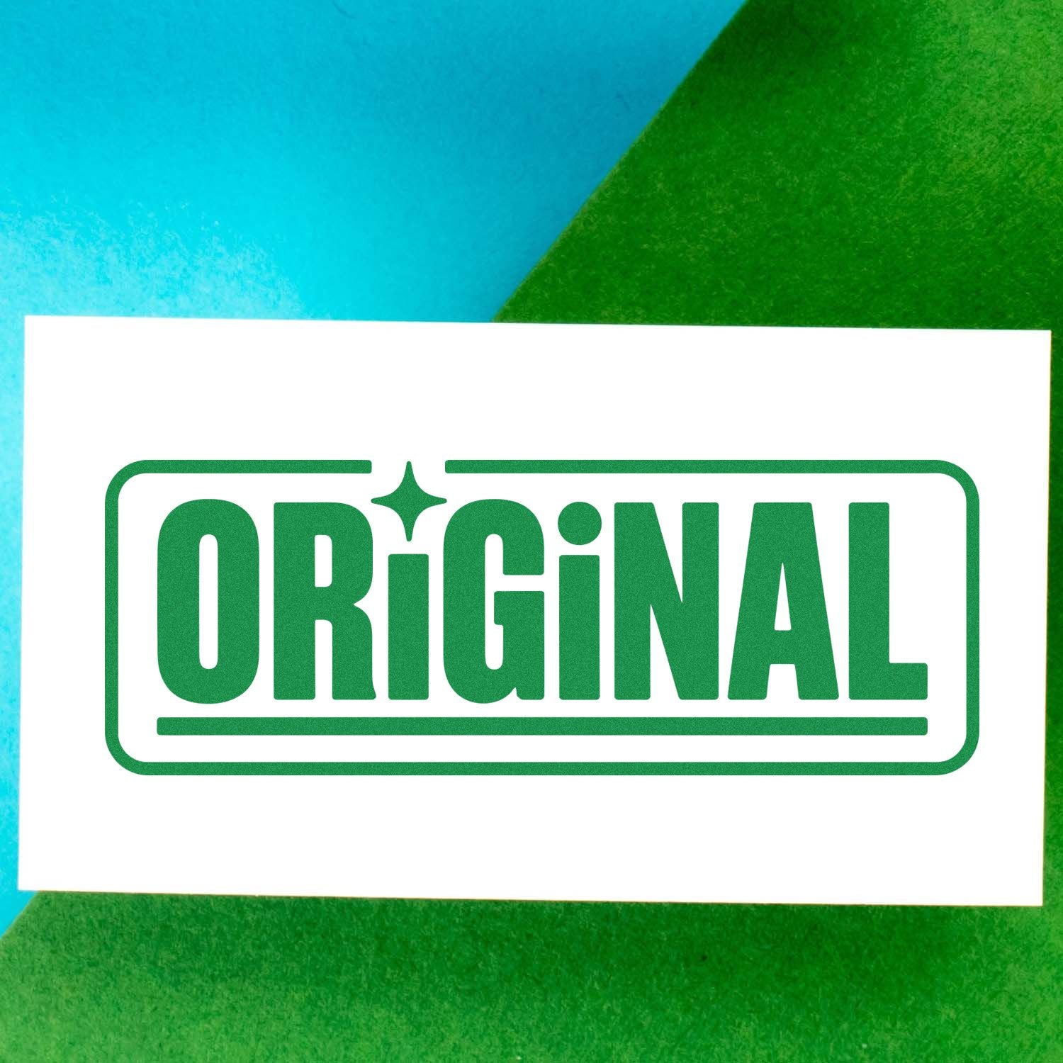 Green ORIGINAL rubber stamp on white paper for branding, packaging, and office marking.