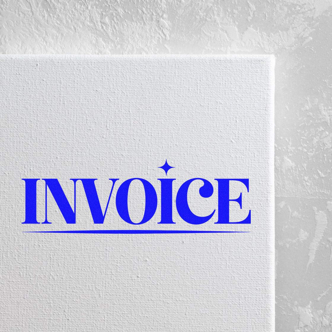 Blue invoice rubber stamp on textured white paper for billing, accounting, and office use.