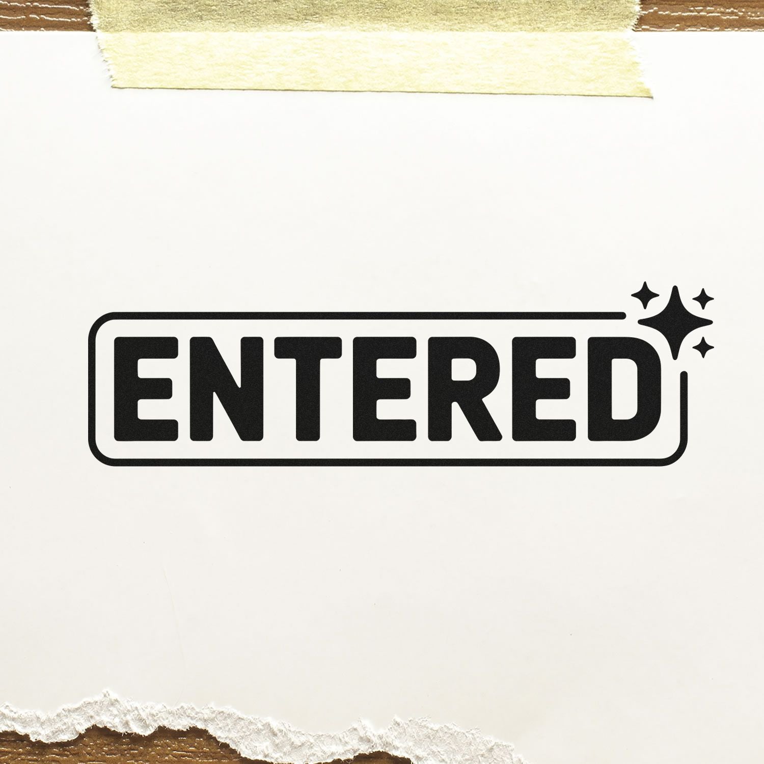 Black ENTERED rubber stamp imprint with sparkle icon on paper, ideal for marking documents as received or processed.