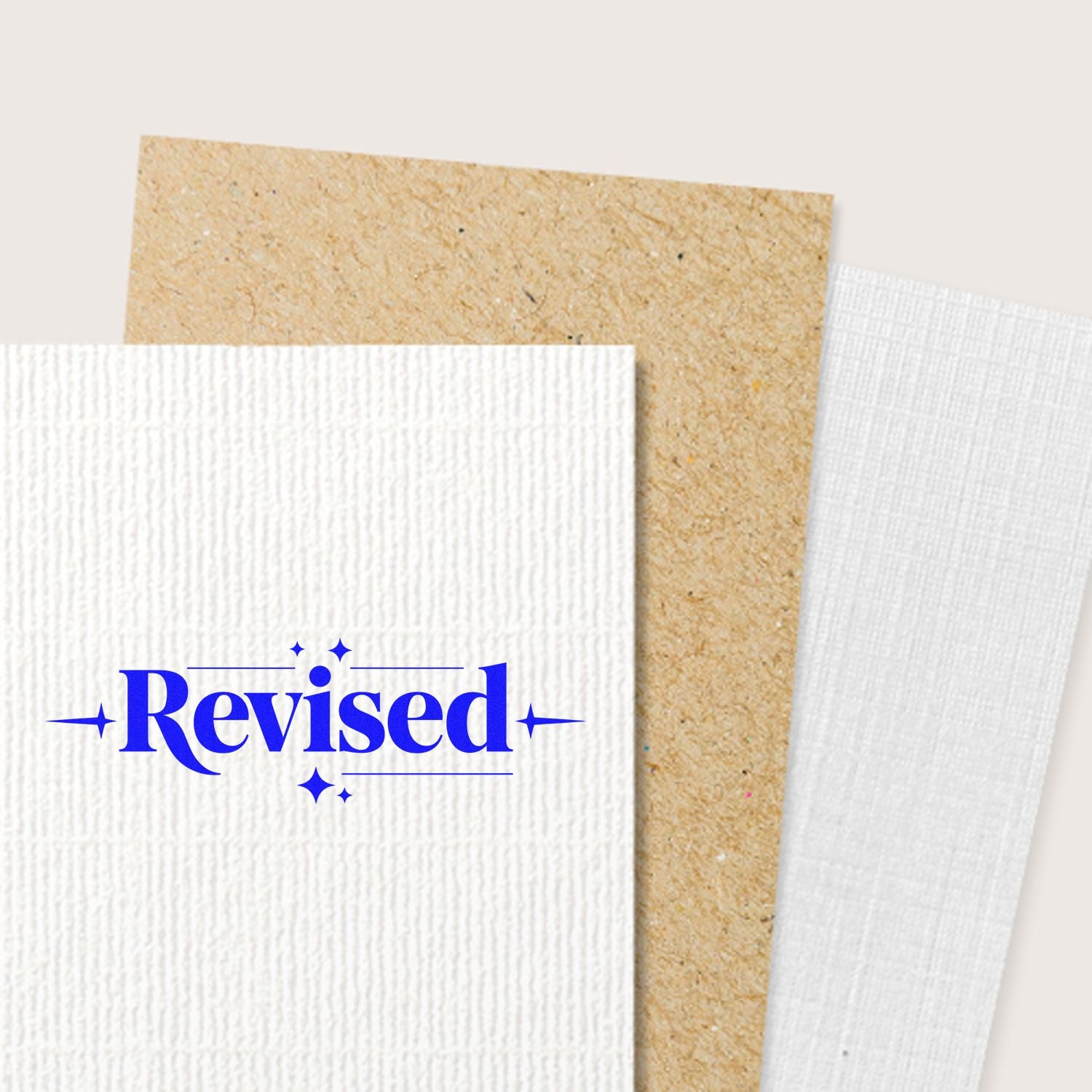 Blue Revised rubber stamp on textured paper, ideal for marking reviewed documents and office approval workflows.