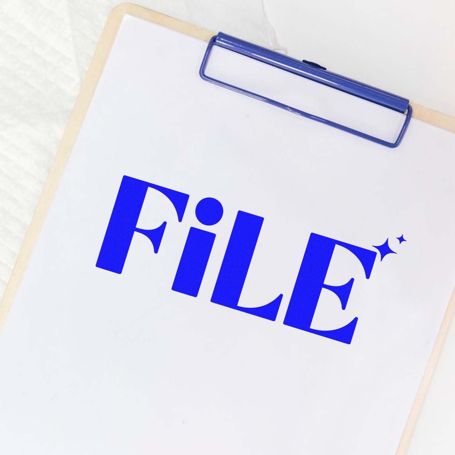Blue FILE rubber stamp on clipboard for office document filing and organization