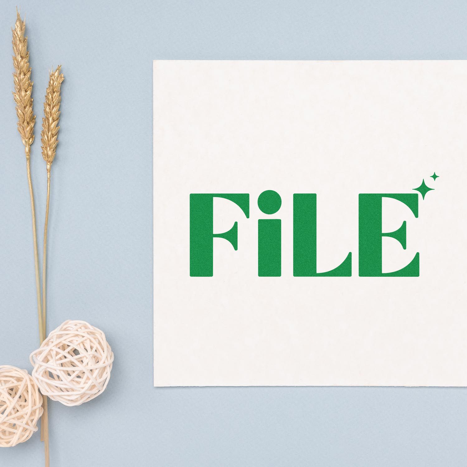 Green FILE rubber stamp design for office document labeling, shown on a white card with decorative accents.