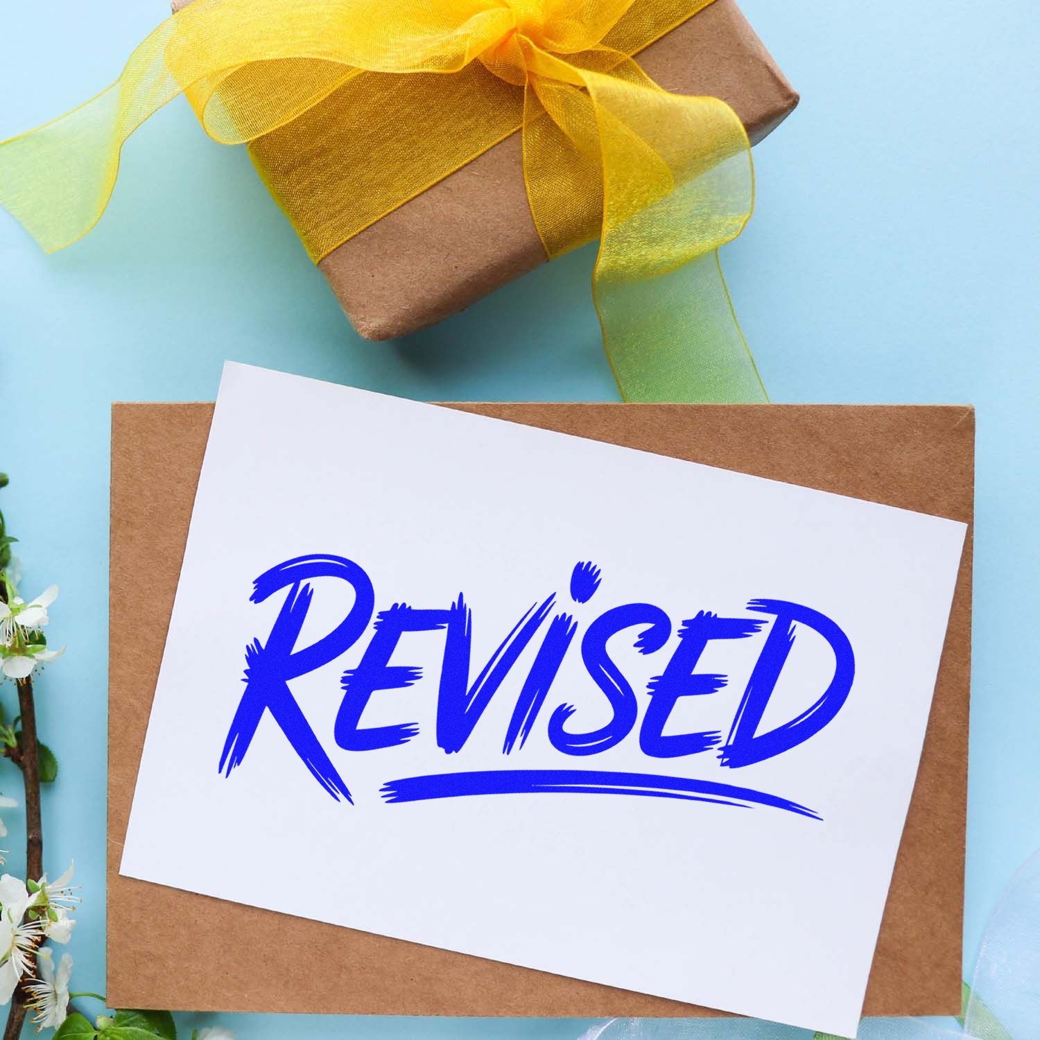 Revised rubber stamp on envelope, perfect for marking document updates, office mail, and craft packaging.