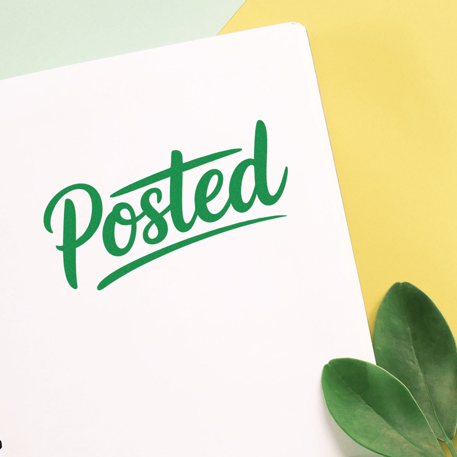 Green Posted rubber stamp impression on white paper for mail processing, packaging, and office organization.