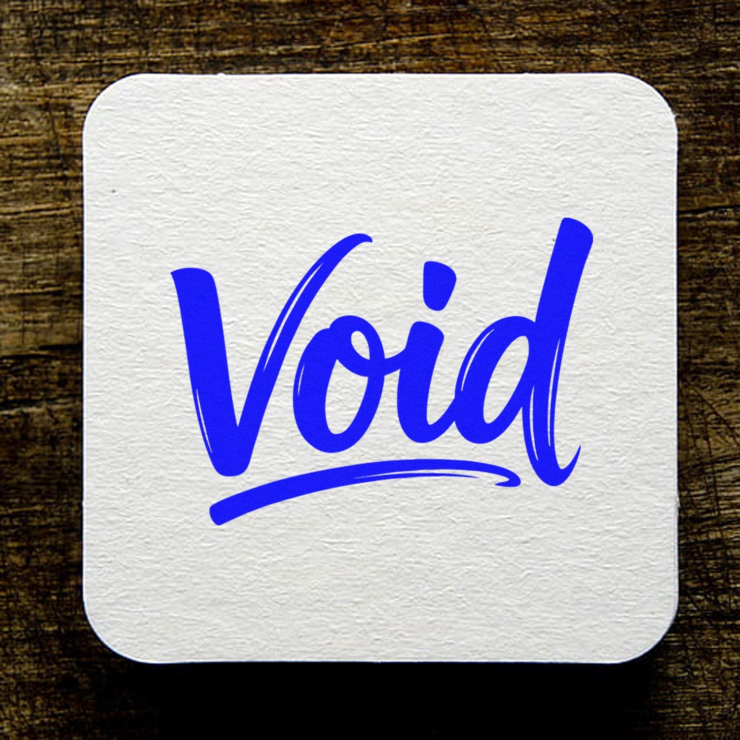 Void rubber stamp design in bold blue script on textured white paper, perfect for canceling forms and labels.