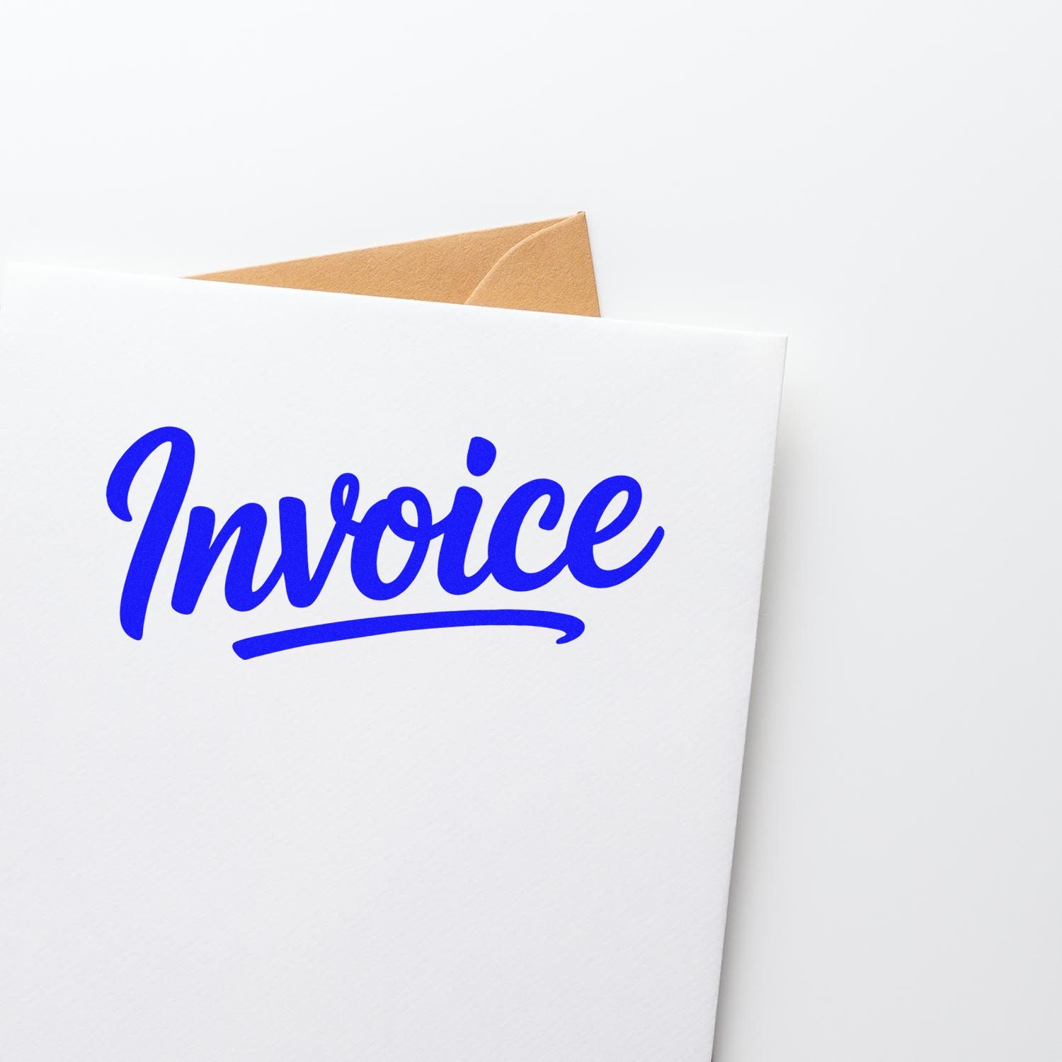 Custom blue invoice rubber stamp on envelope for billing, accounting, and office mail