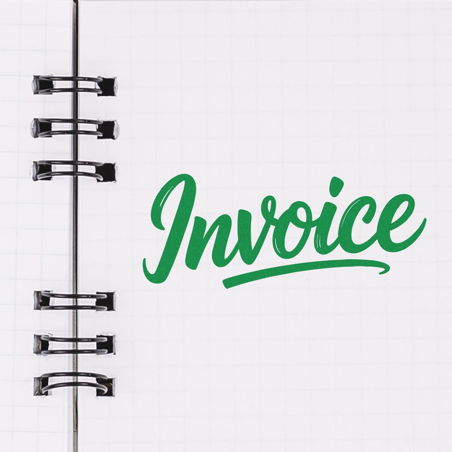 Green Invoice rubber stamp on a notebook page for billing and accounting organization.