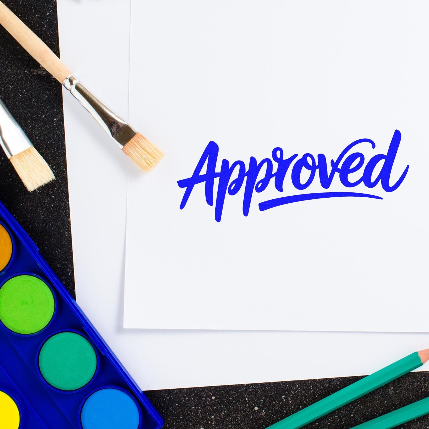 Approved rubber stamp impression on white paper, featuring paintbrushes and watercolor palette for arts and office use.