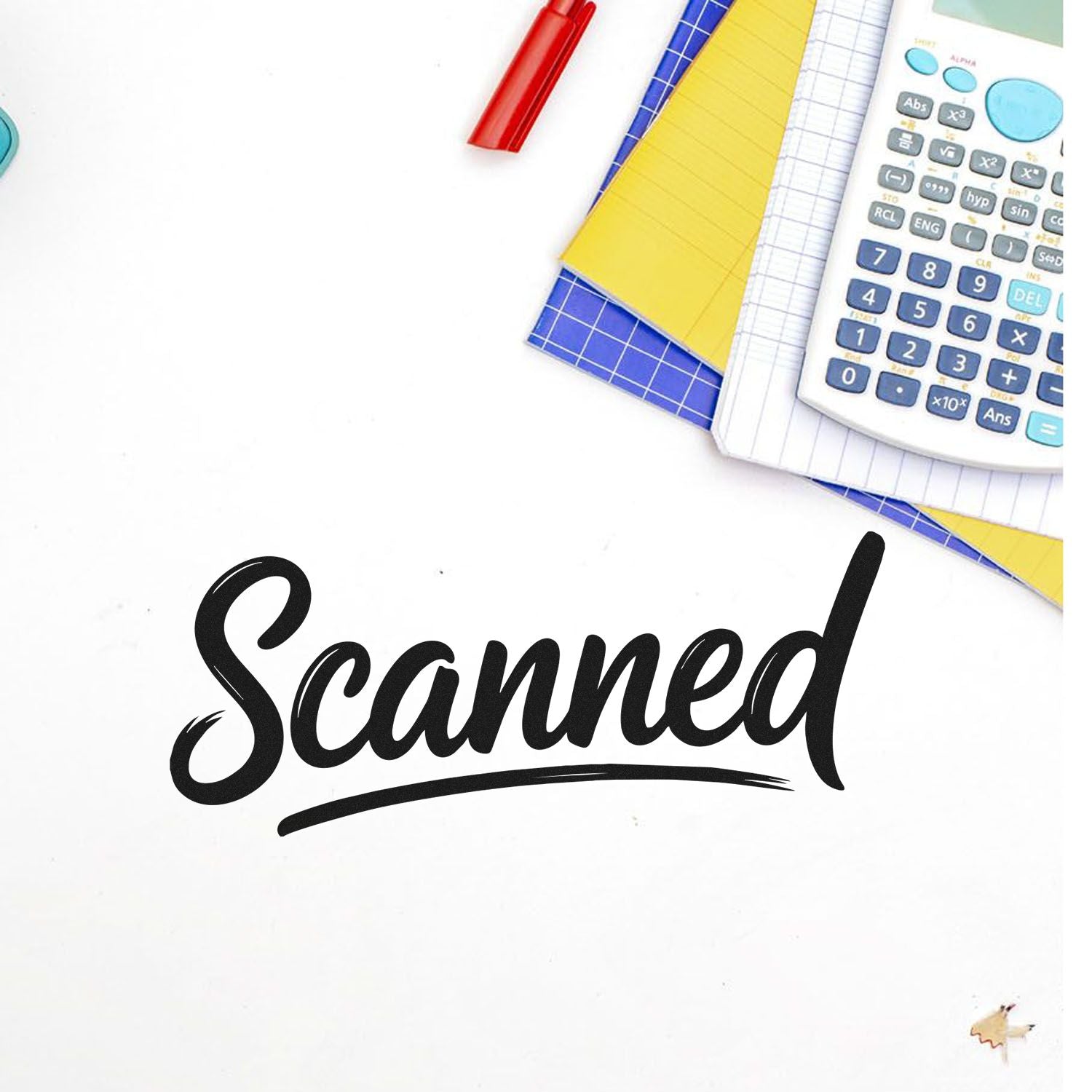 Scanned rubber stamp on paperwork with calculator and notebooks for document processing.