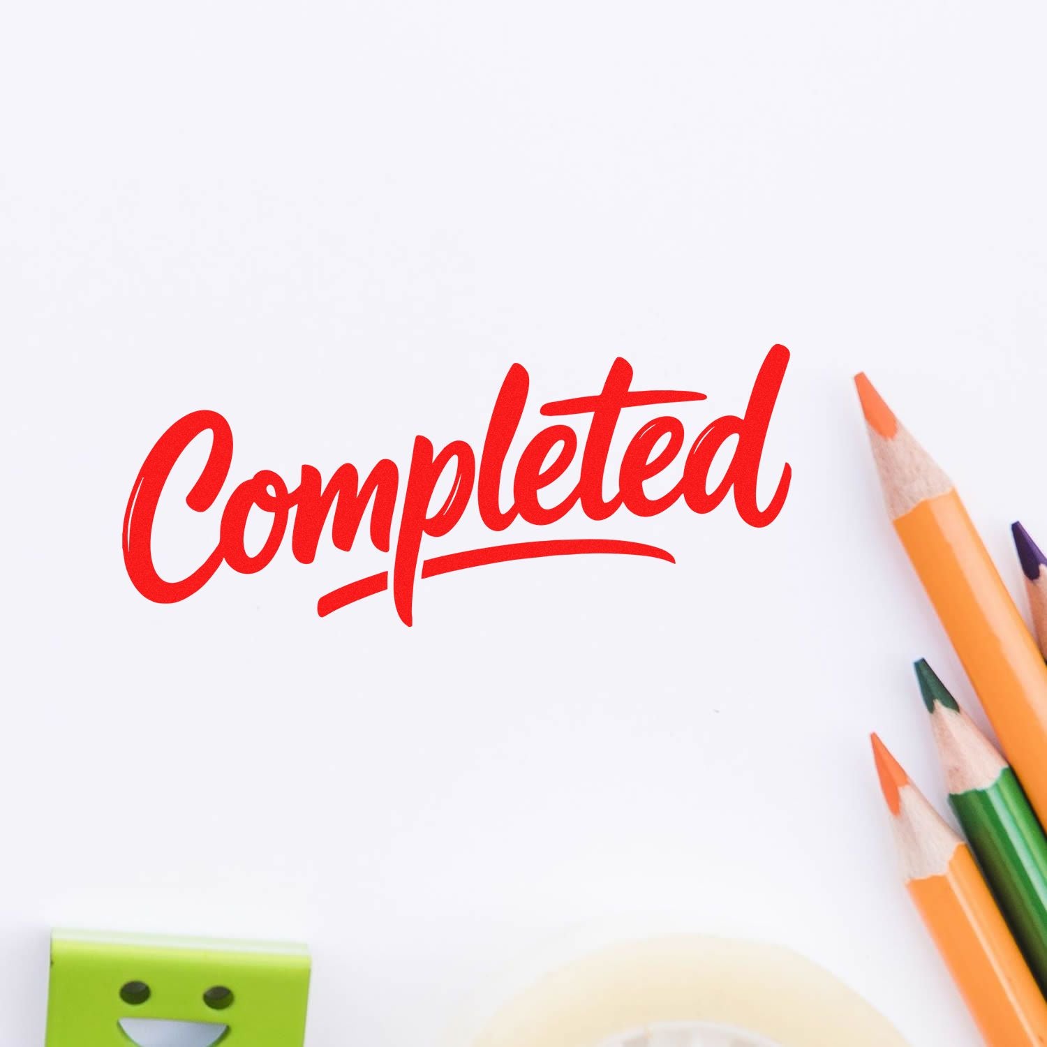 Red completed rubber stamp text with colored pencils, ideal for task approval, office forms, and school project marking.