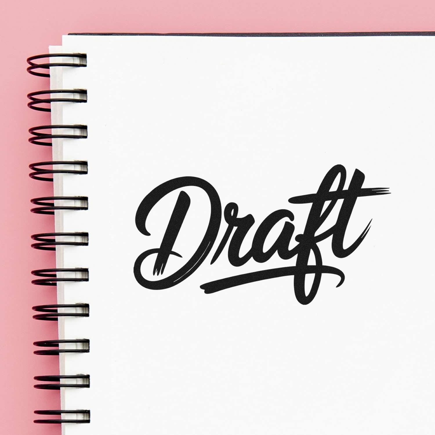 Draft rubber stamp design in bold script, ideal for marking documents, journals, and planners.