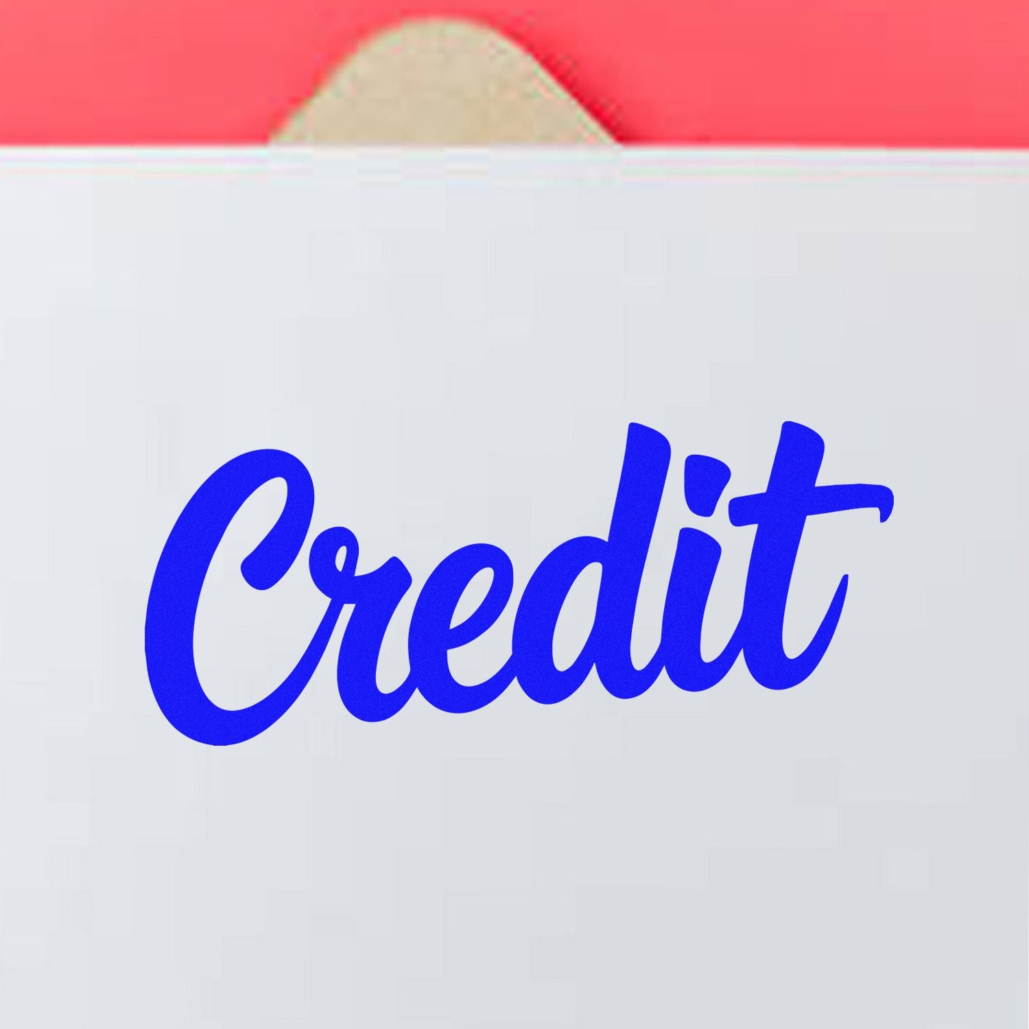 Blue Credit rubber stamp on white envelope, ideal for accounting, billing, and office document processing.