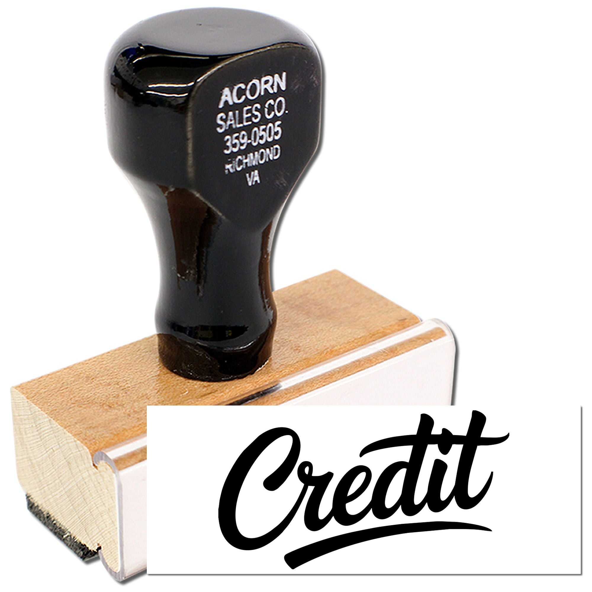Custom rubber credit stamp with wooden handle for office accounting and document approval.