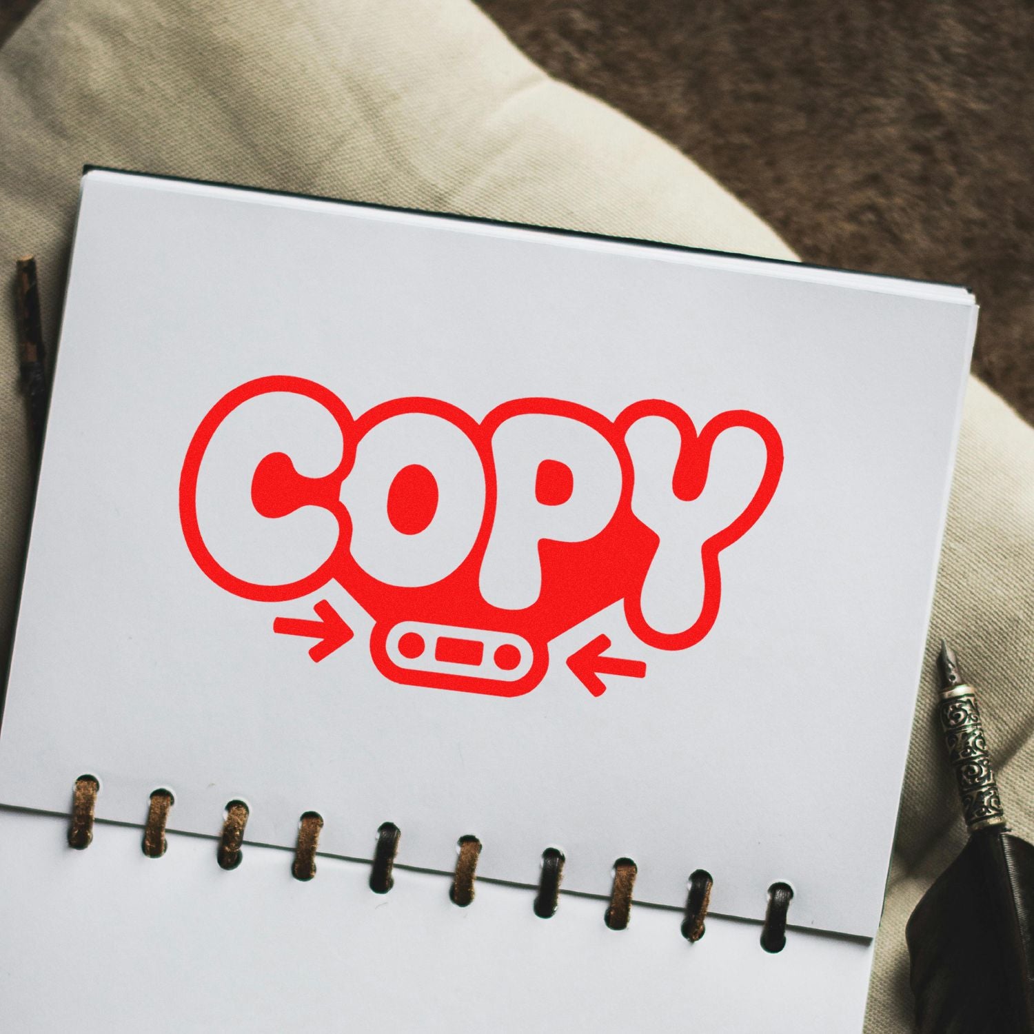 Red COPY rubber stamp design on a notebook page, showing a copy mark for office documents and branding.