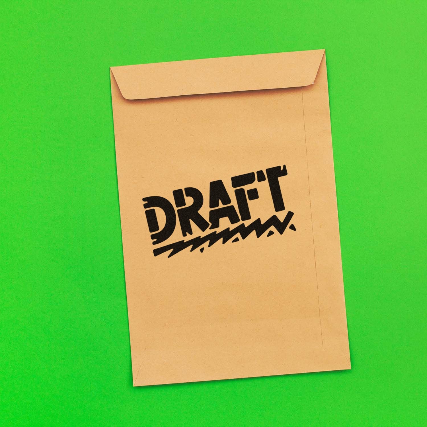 DRAFT rubber stamp impression on manila envelope, ideal for marking documents during office review and mail sorting.
