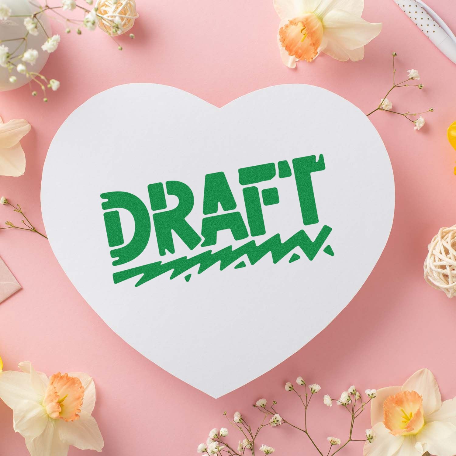 Heart-shaped card stamped DRAFT, featuring a custom rubber stamp design for stationery, crafts, and paper products.