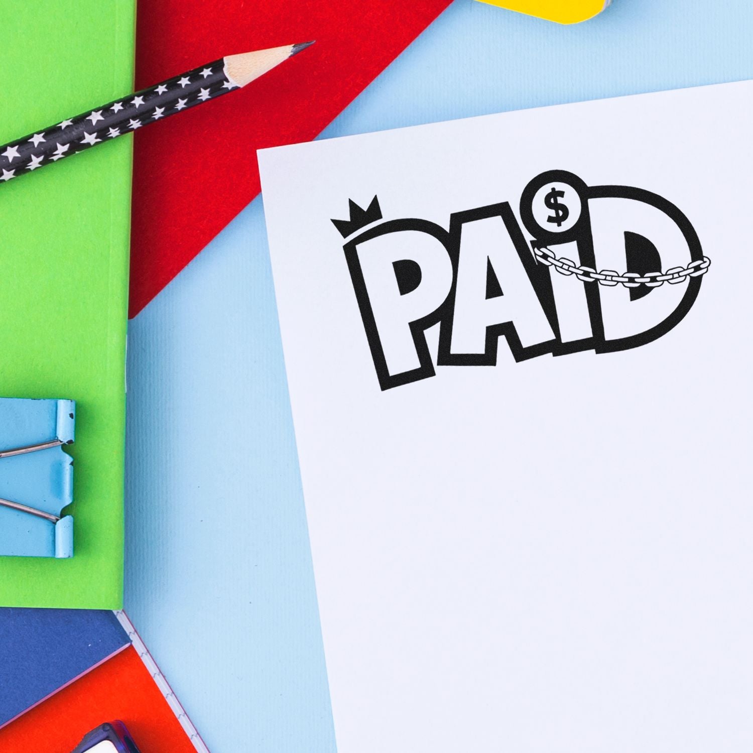 Paid rubber stamp on invoice paper for accounting, billing, and office paperwork.