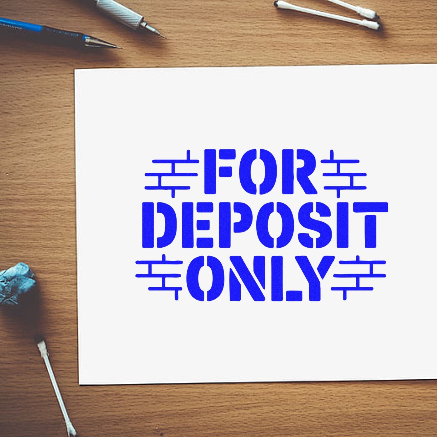 Blue FOR DEPOSIT ONLY rubber stamp design on white paper, ideal for banking and check endorsement use.