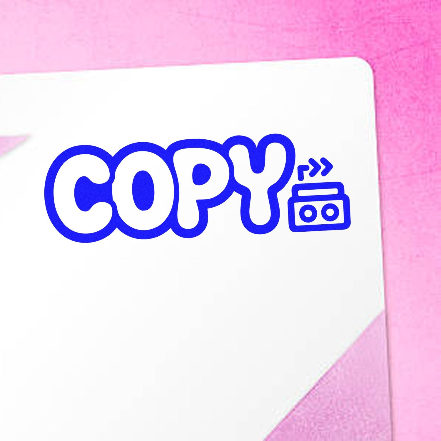 Copy rubber stamp design with bold blue lettering and cassette icon for office documents, photocopy labeling, and file marking.