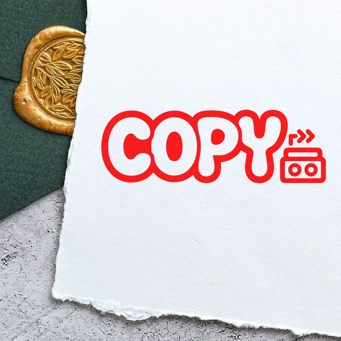 Red COPY rubber stamp on paper for document duplication, office filing, and records management