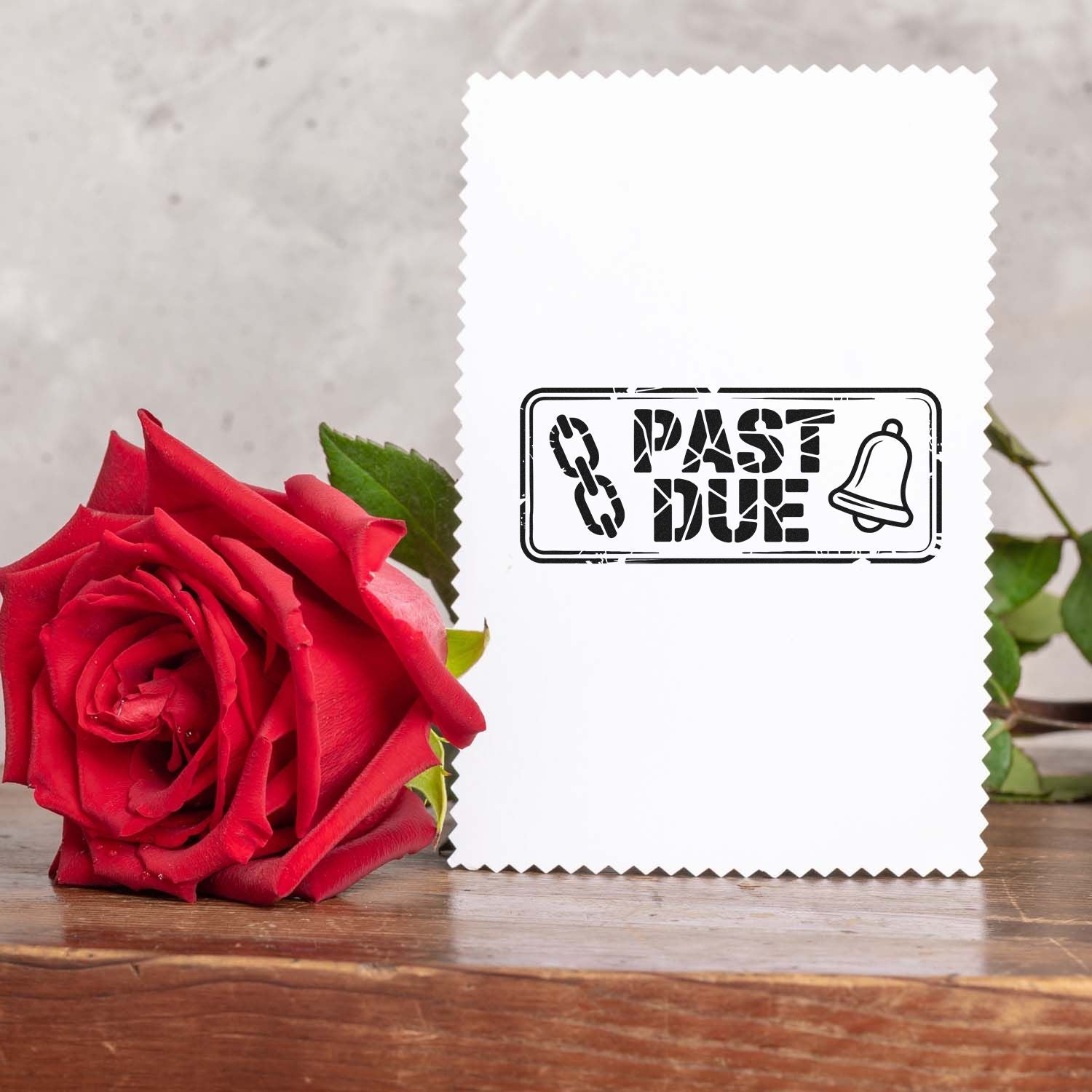 Past due rubber stamp design with bell icon on white card, ideal for invoice reminders and business mailing.