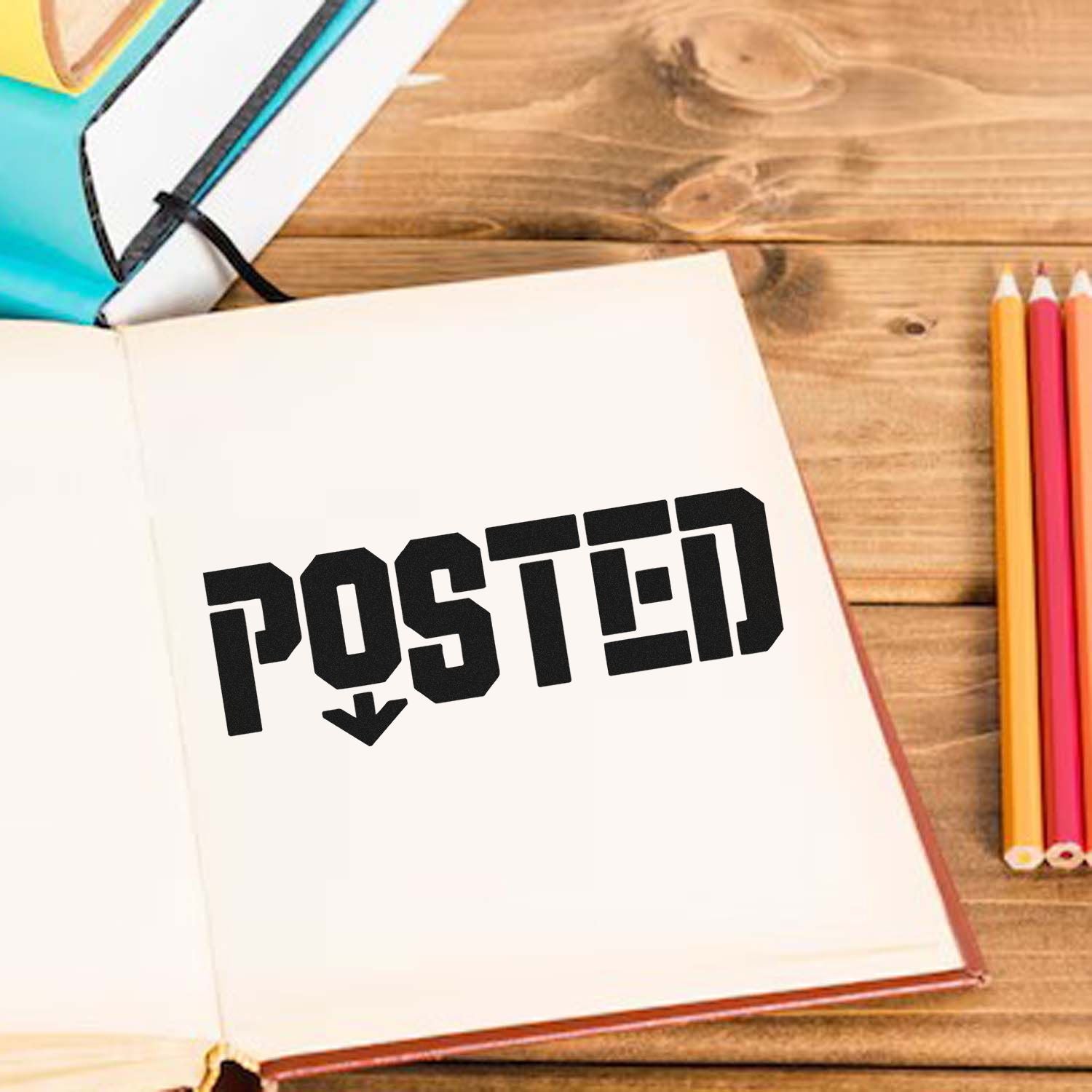 Custom rubber stamp POSTED imprint on notebook page for office mail tracking and document organization.