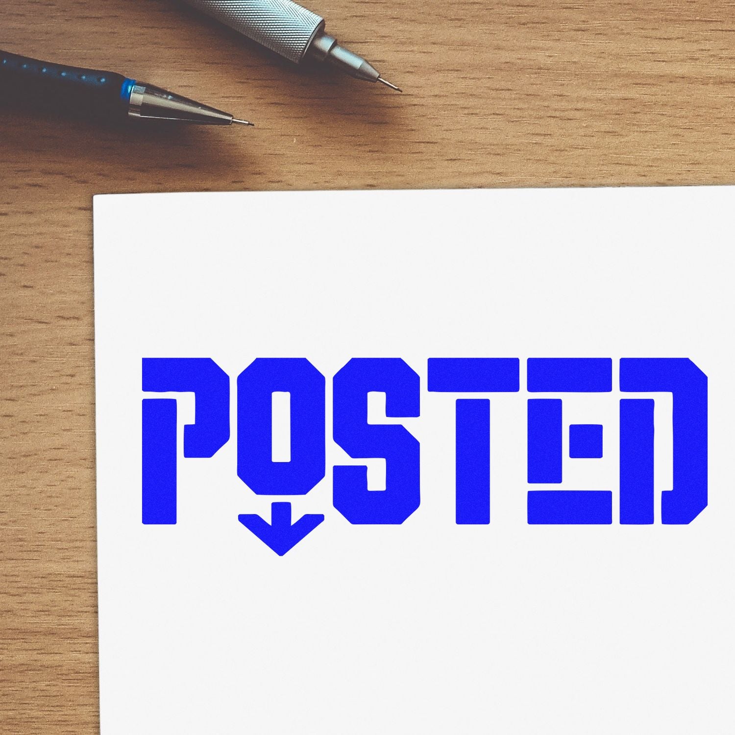 Blue POSTED rubber stamp impression on paper, ideal for office mail processing and custom business stamps.