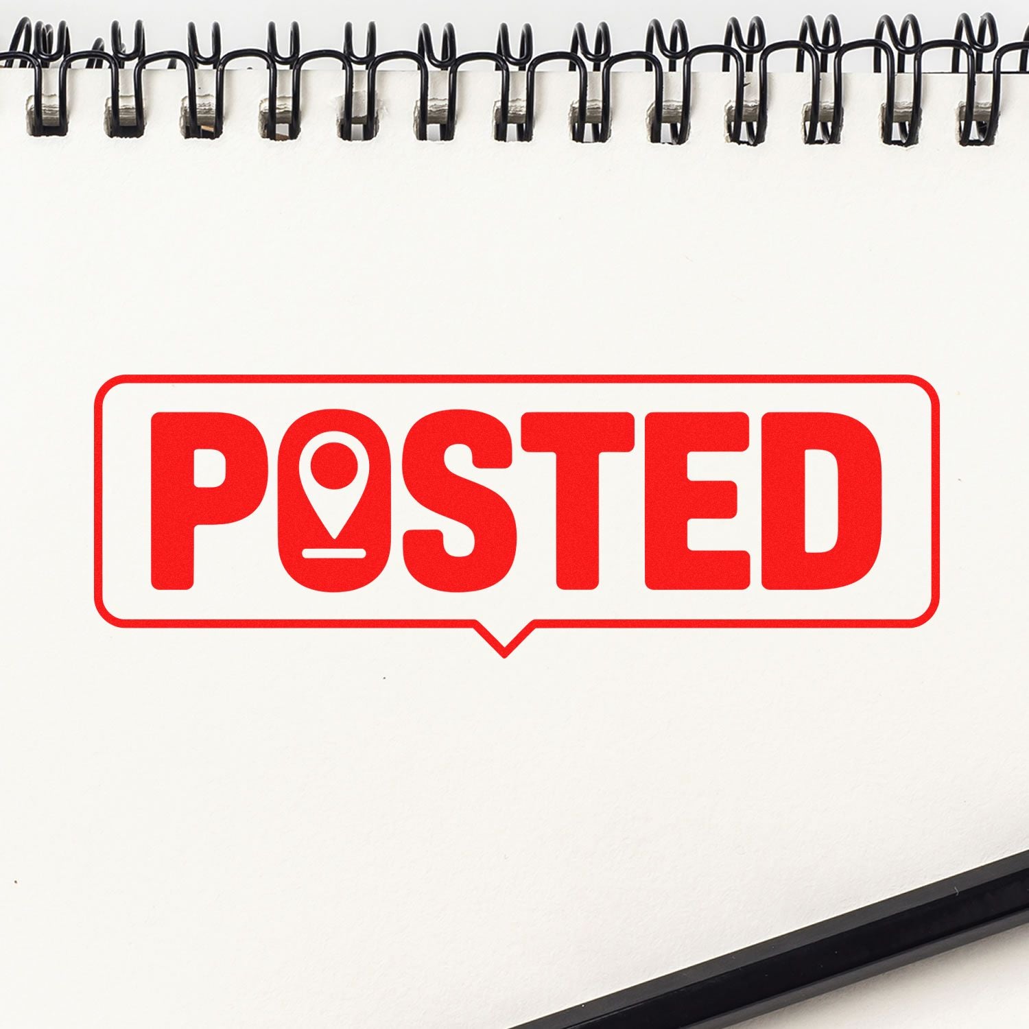 Red POSTED rubber stamp with location pin icon on notebook page, ideal for office mail, approvals, or social media updates.