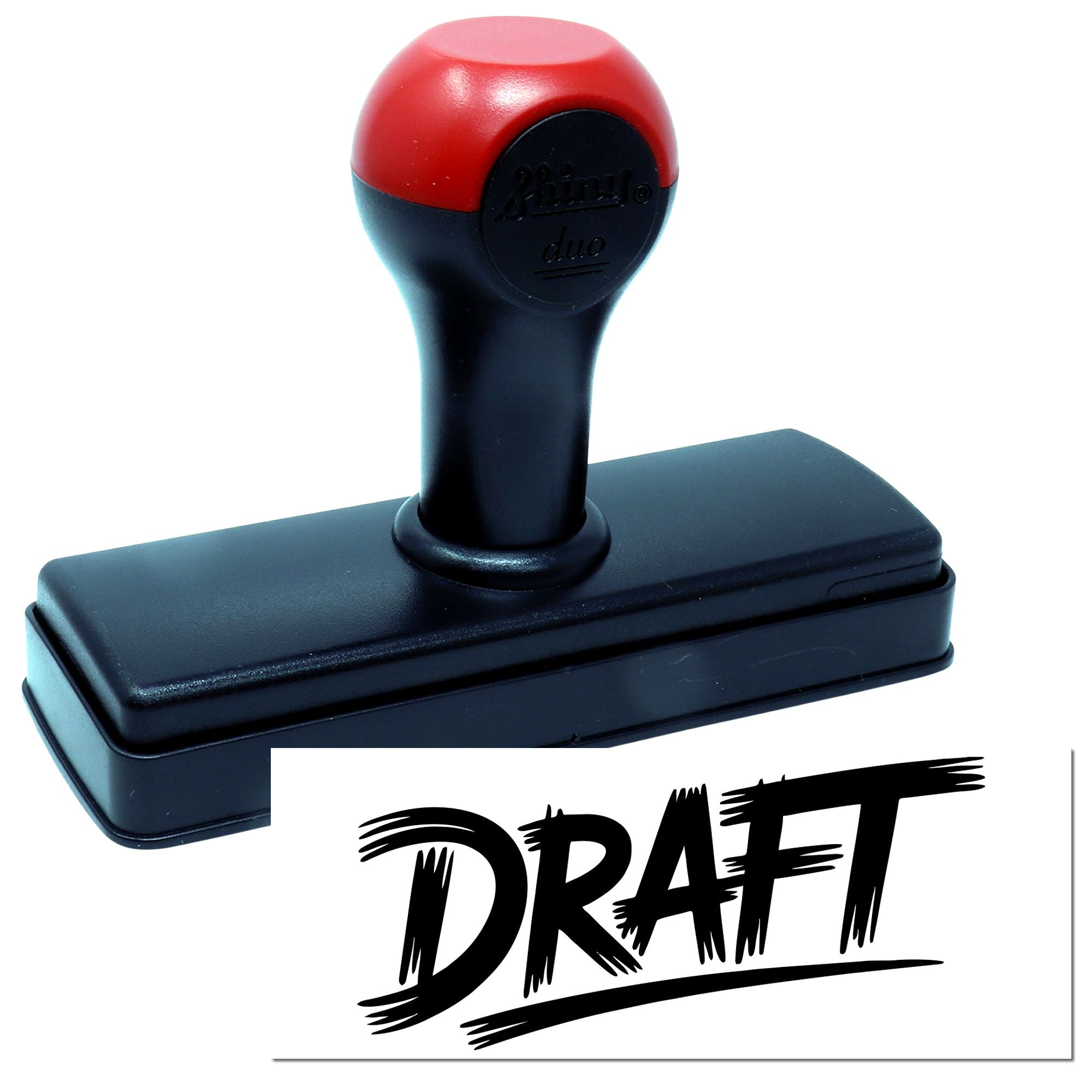 Custom draft rubber stamp with red and black handle, showing bold DRAFT imprint for office document marking.