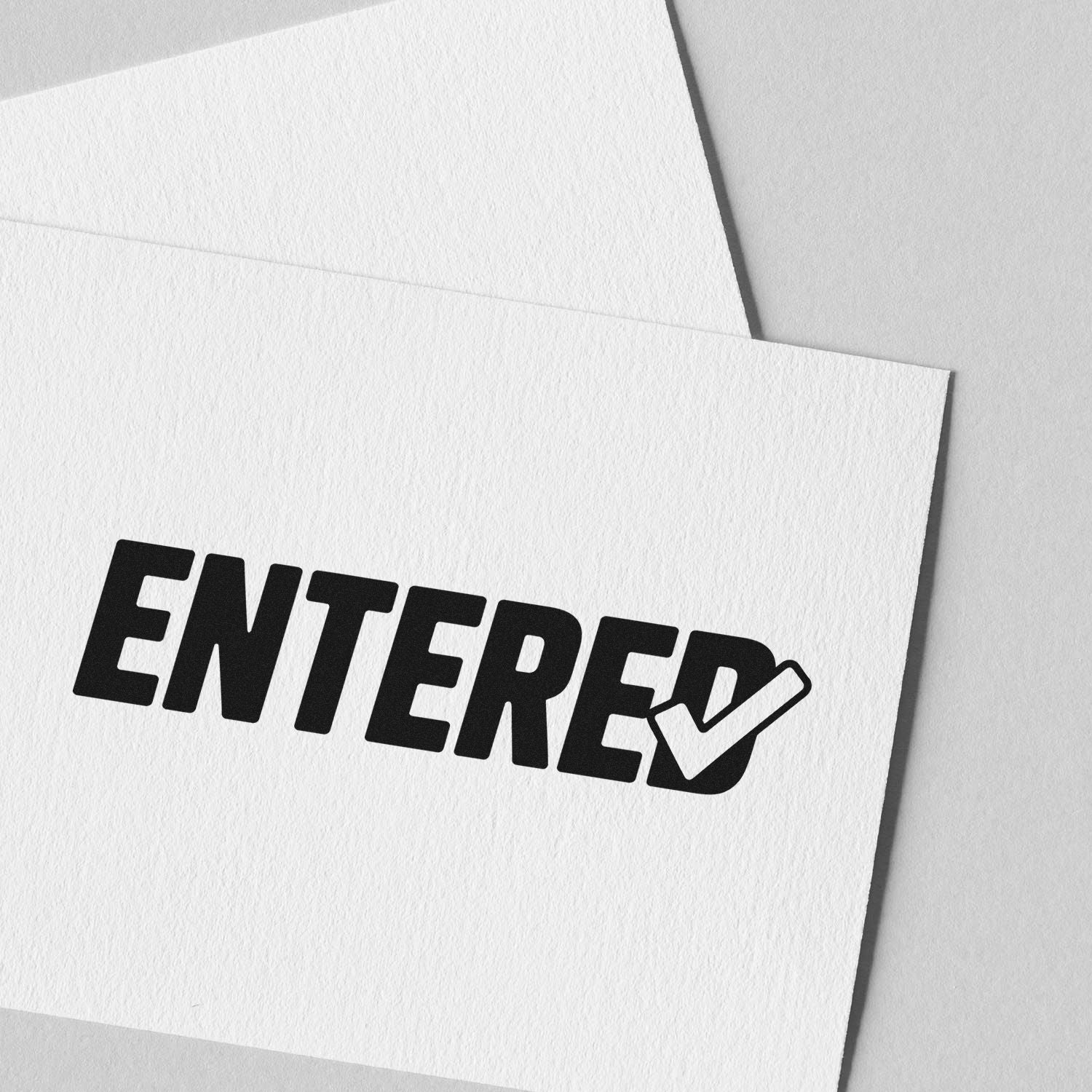 Entered rubber stamp impression on white paper, showing office mail processing or document approval.