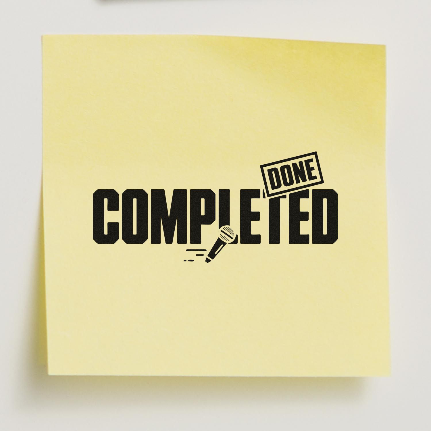 Completed rubber stamp with microphone icon on yellow note, marking finished podcast or audio project approvals.