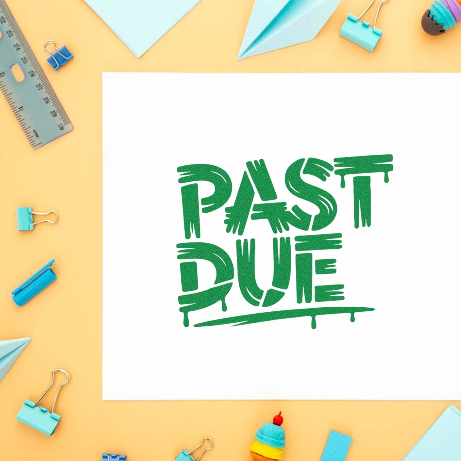 Past Due rubber stamp design for office paperwork, displayed on a craft desk with stationery supplies.